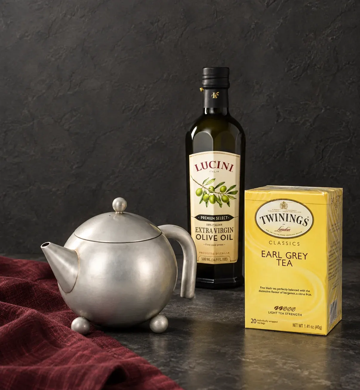 Twinings tea, Lucini olive oil and a Henley teapot on a stone counter