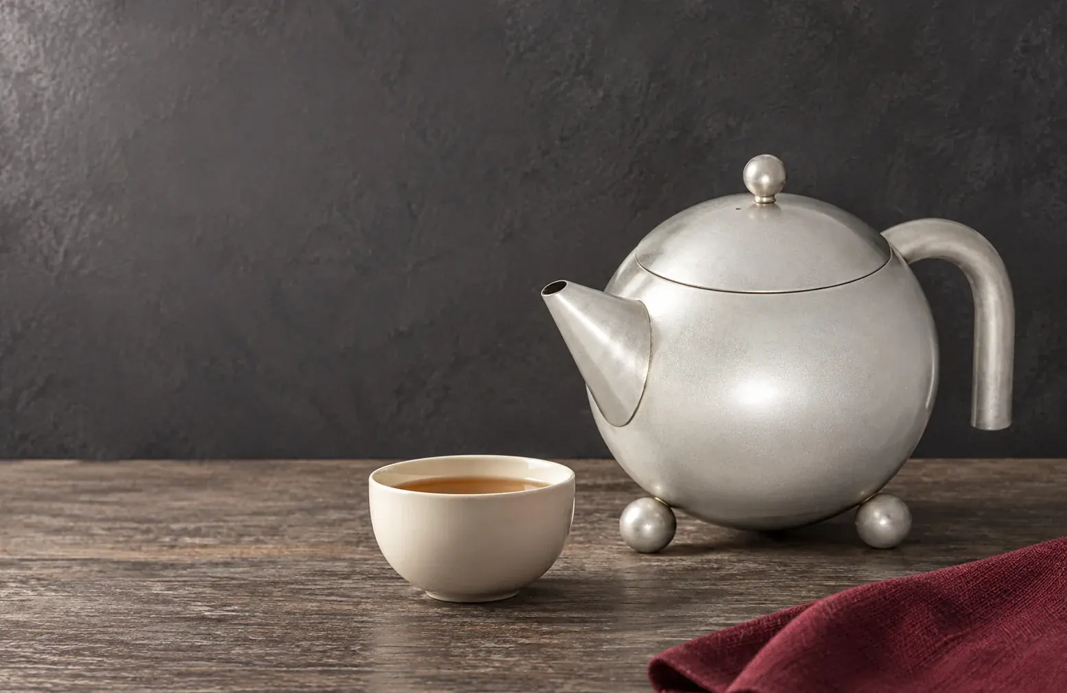 Silver-grey Henley teapot on a dark table